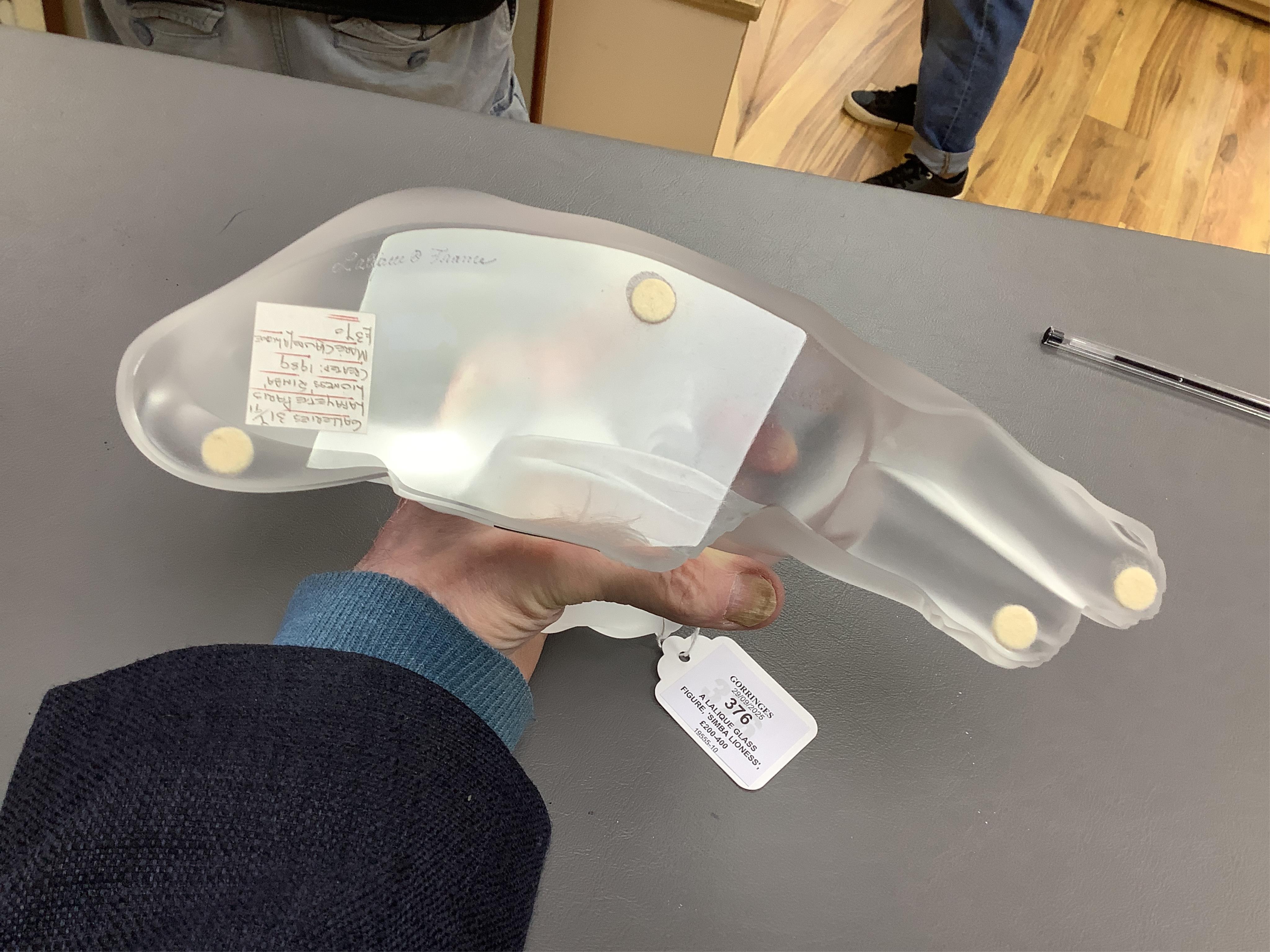 A Lalique glass figure, ‘Simba Lioness’, signed to the base, boxed, 24cm wide